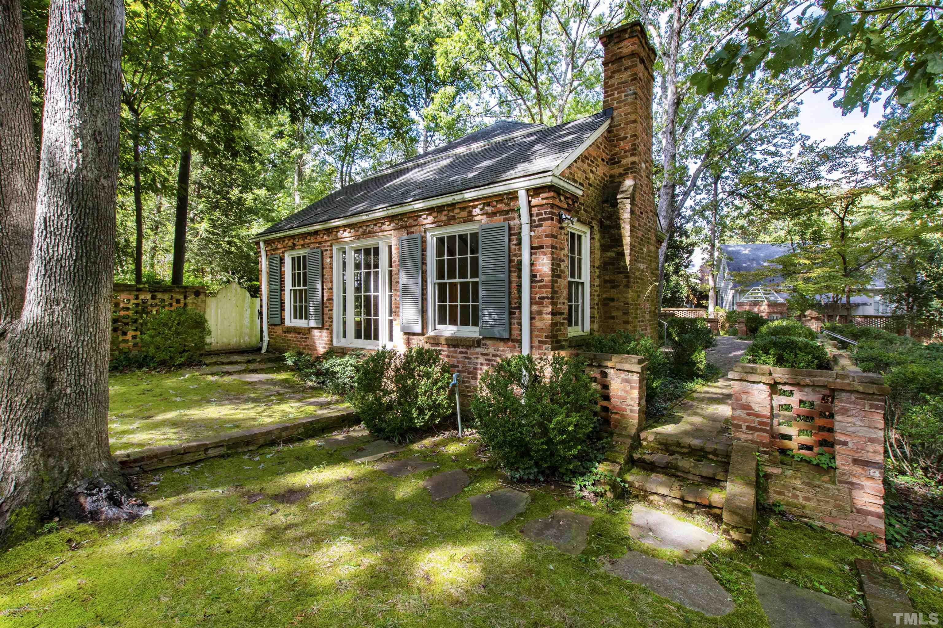 3231 Sussex Road Raleigh, NC 27607 - Photo 50 of 60 a view of a house with backyard and sitting area