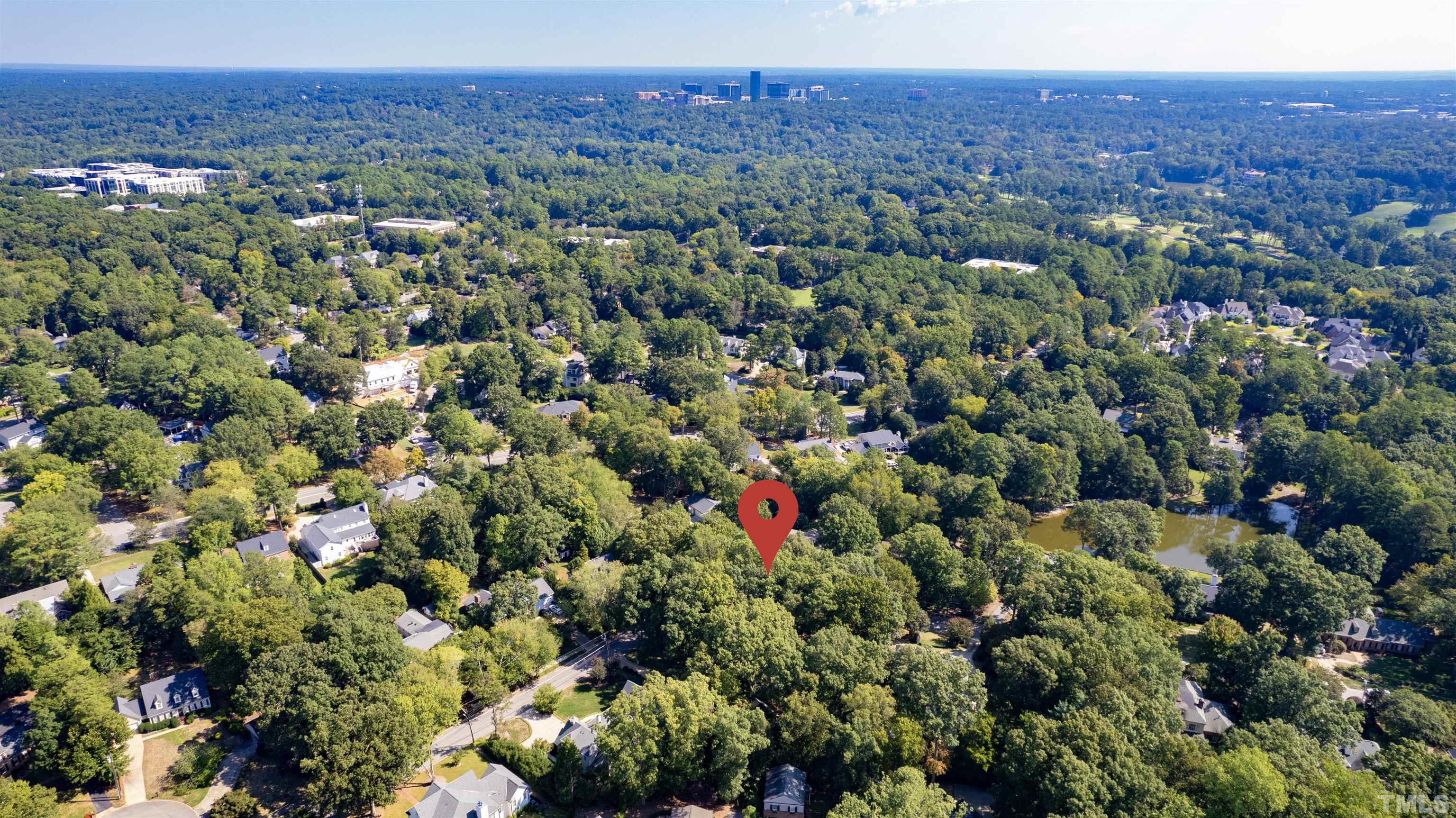 3231 Sussex Road Raleigh, NC 27607 - Photo 57 of 60 a view of a city with lush green forest