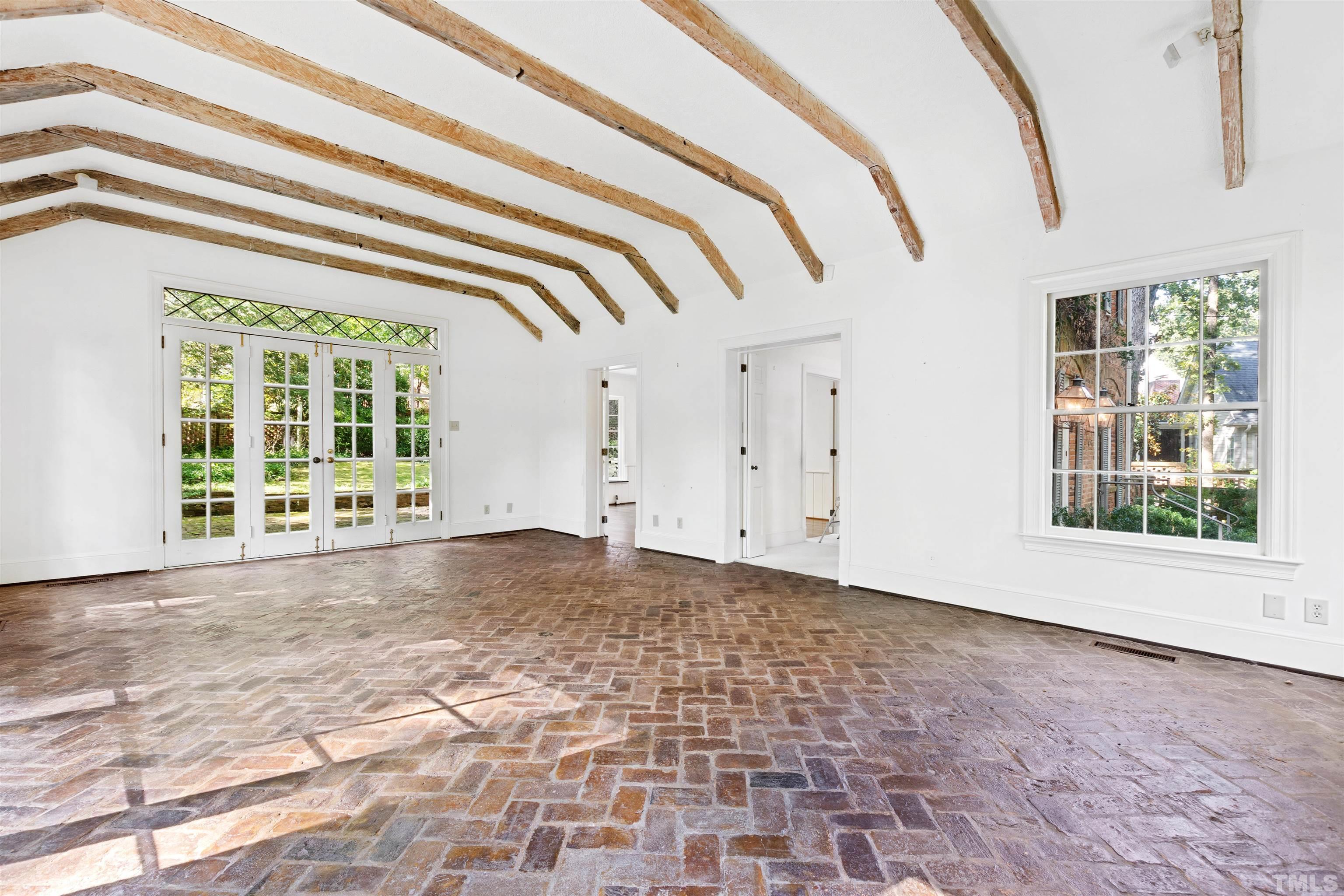 3231 Sussex Road Raleigh, NC 27607 - Photo 6 of 60 a view of an empty room with a window