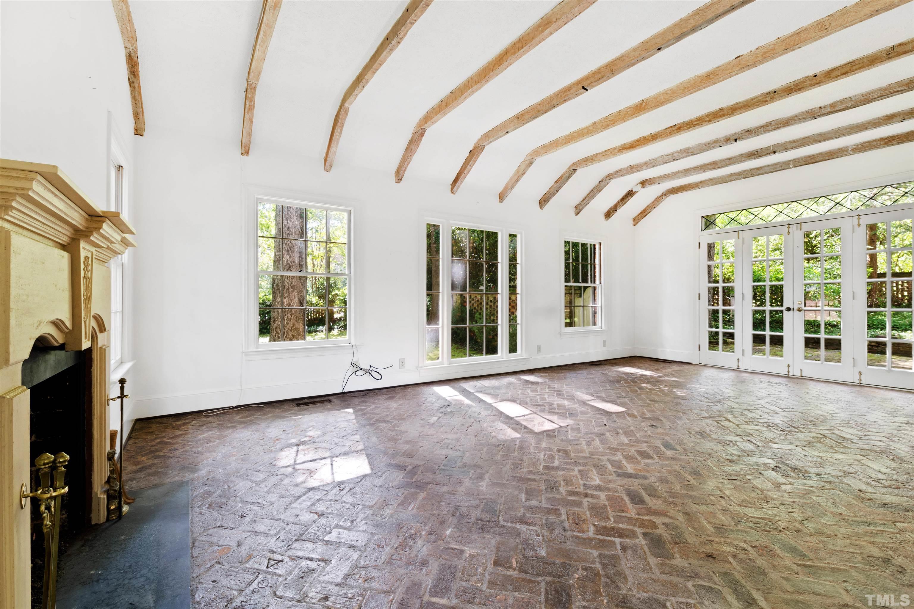 3231 Sussex Road Raleigh, NC 27607 - Photo 7 of 60 a view of an empty room with a window