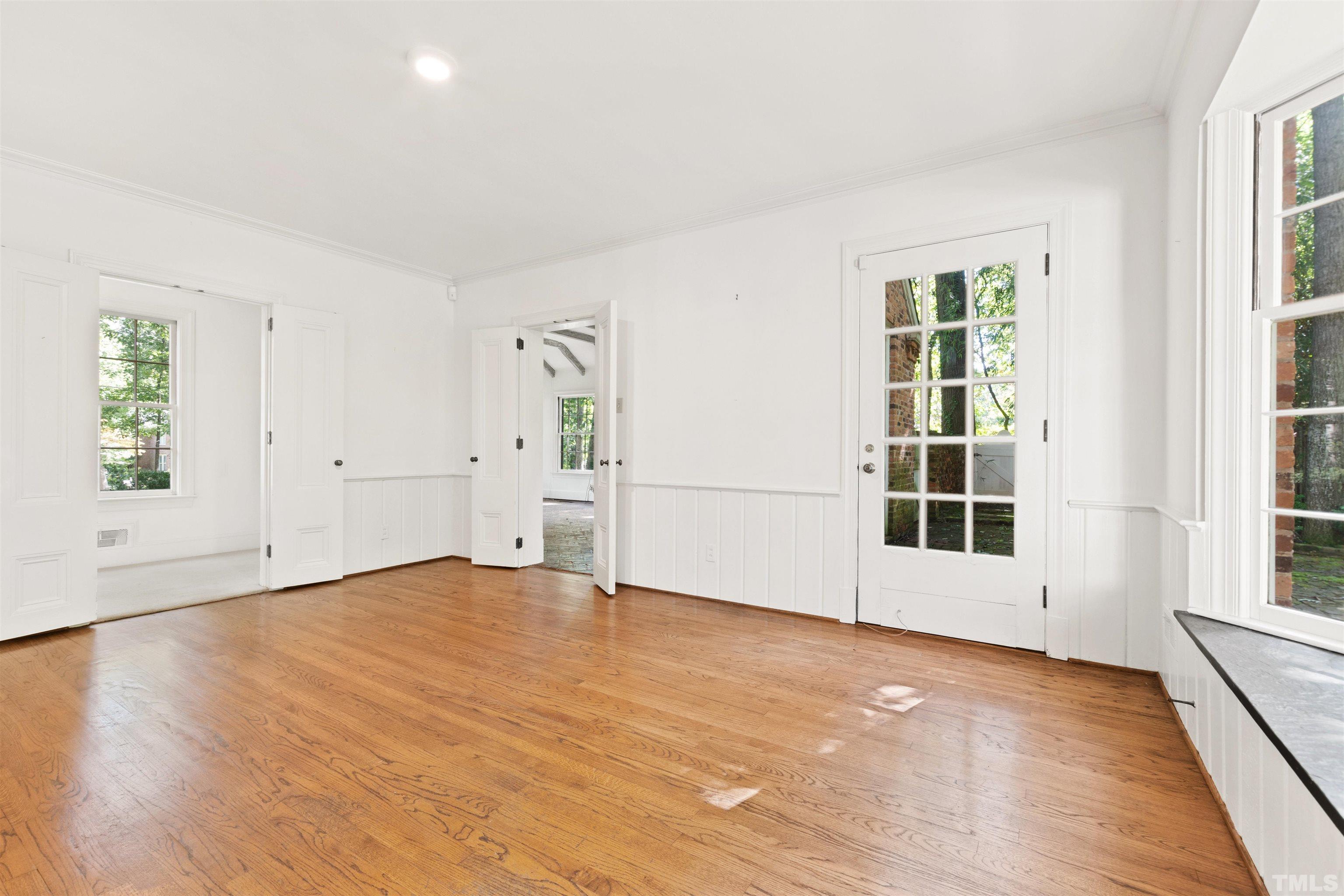 3231 Sussex Road Raleigh, NC 27607 - Photo 10 of 60 an empty room with windows and entrance