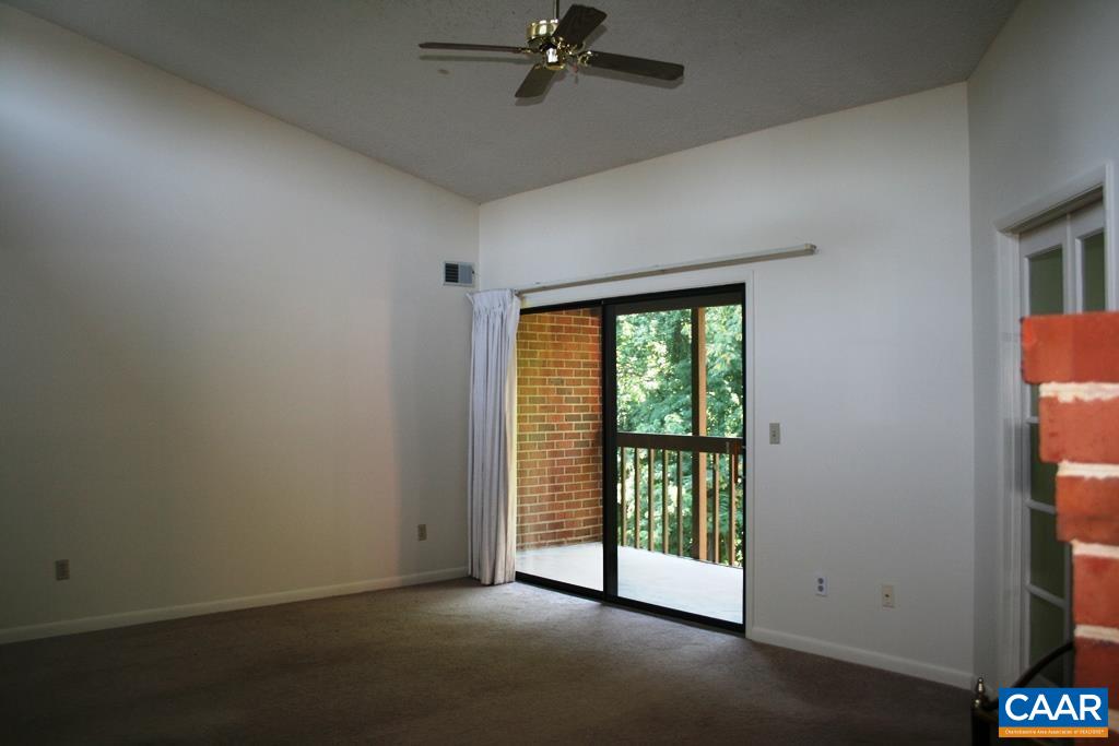 117 Turtle Creek Road, Unit 10 Charlottesville, VA 22901 - Photo 4 of 12 an empty room with windows