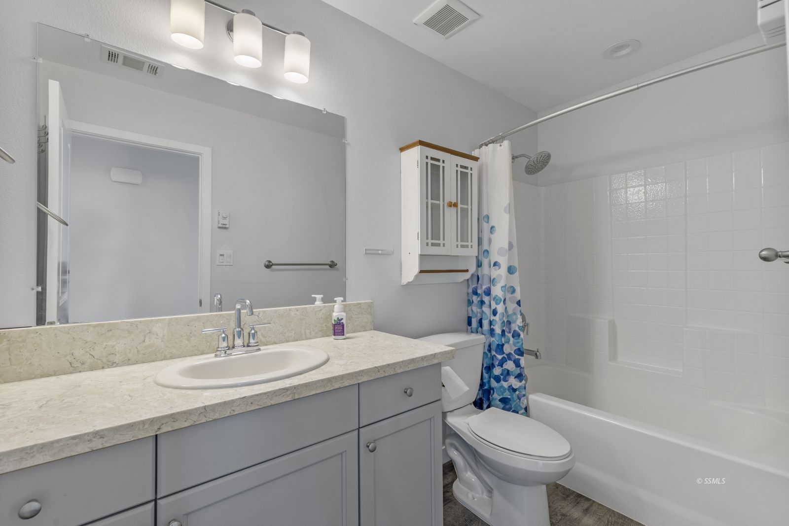 1200 South McCall Street Ridgecrest, CA 93555 - Photo 23 of 30 a bathroom with a sink toilet and shower