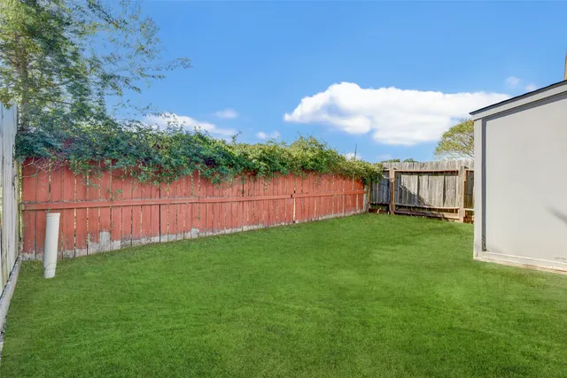a view of backyard with green space