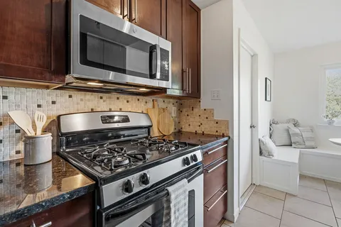a kitchen with a stove and a microwave