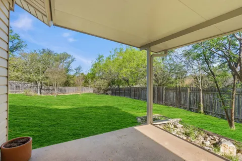 a view of a patio with a yard