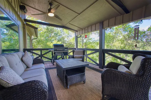 a balcony with furniture and a garden