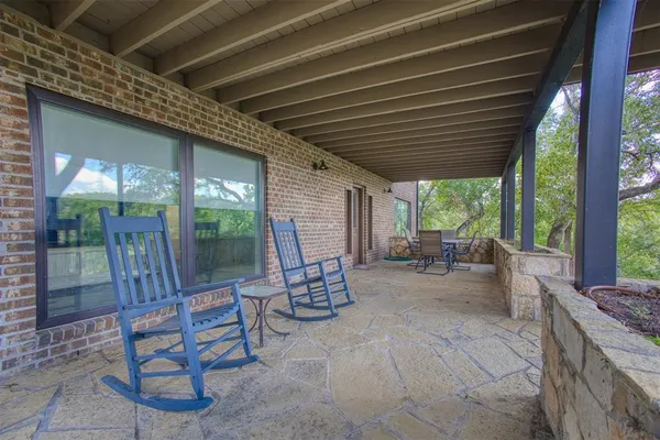 a building outdoor space with patio furniture and garden