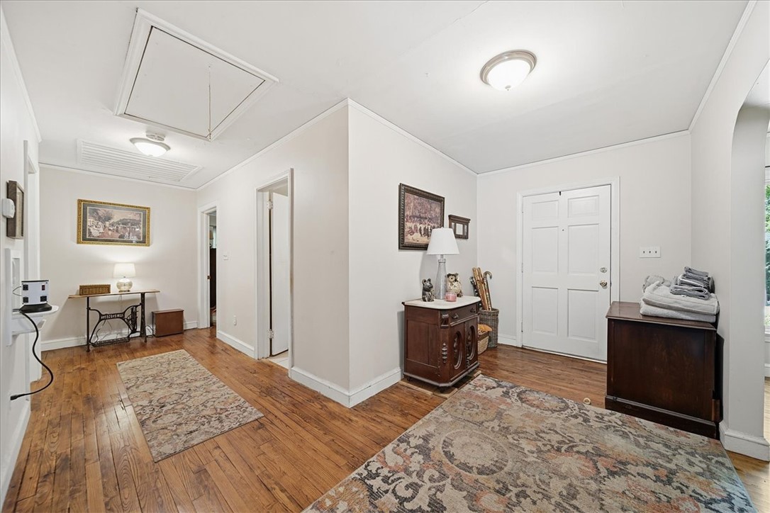 504 Jeb Stuart Avenue Anderson, SC 29621 - Photo 23 of 47 This entry hall features hardwood flooring and classic white paneled doors, creating a warm and inviting space.