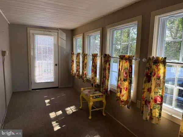 a view of livingroom with furniture and windows