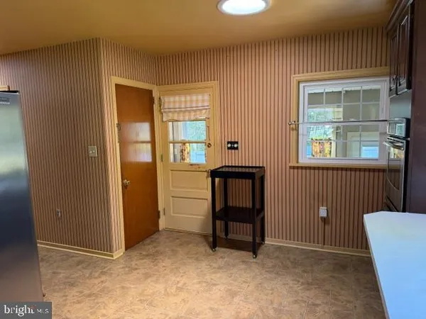 a living room with furniture fireplace and flat screen tv