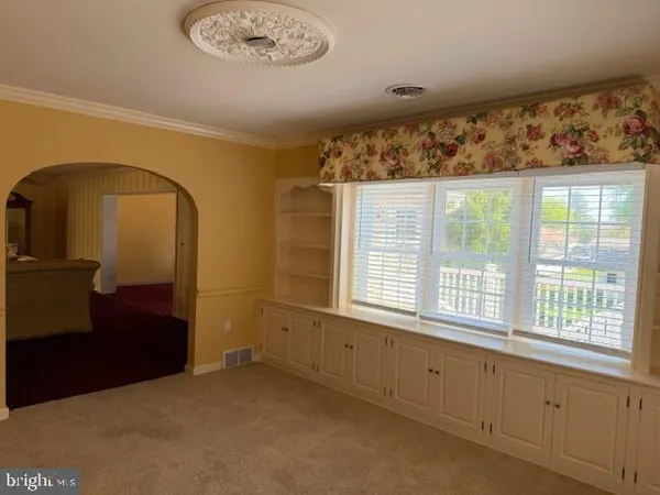a living room with furniture fireplace and flat screen tv
