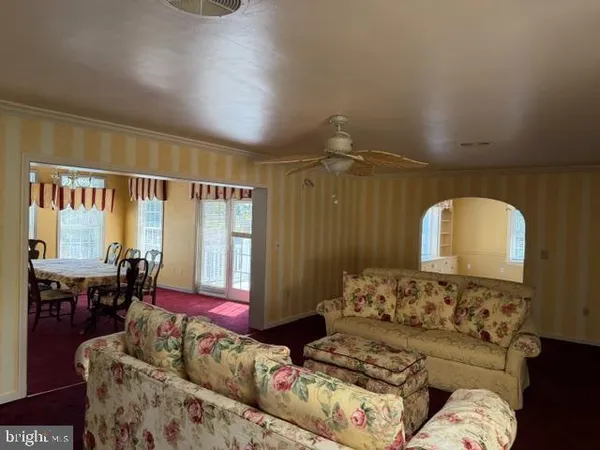 a living room with furniture fireplace and flat screen tv