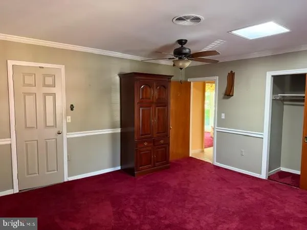 a view of a dining room with furniture and window