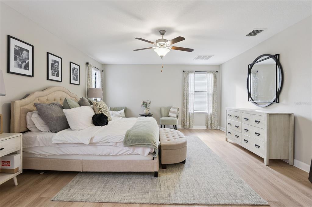 8816 Shady Pavillion Court Land O Lakes, FL 34637 - Photo 23 of 64 a living room with furniture and a mirror