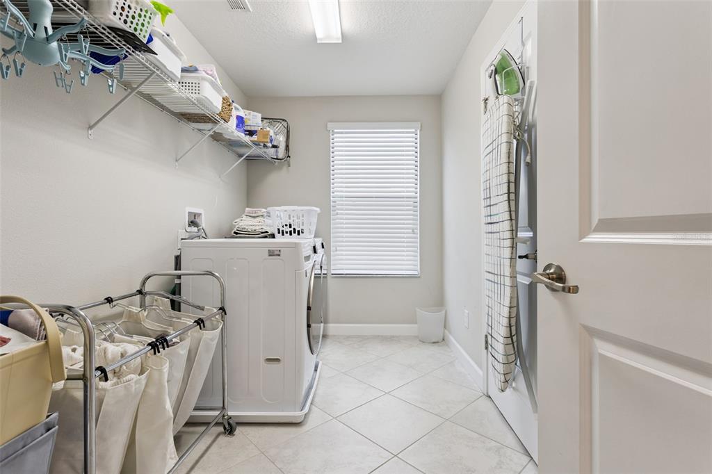 8816 Shady Pavillion Court Land O Lakes, FL 34637 - Photo 39 of 64 a view of a storage & utility room with a window