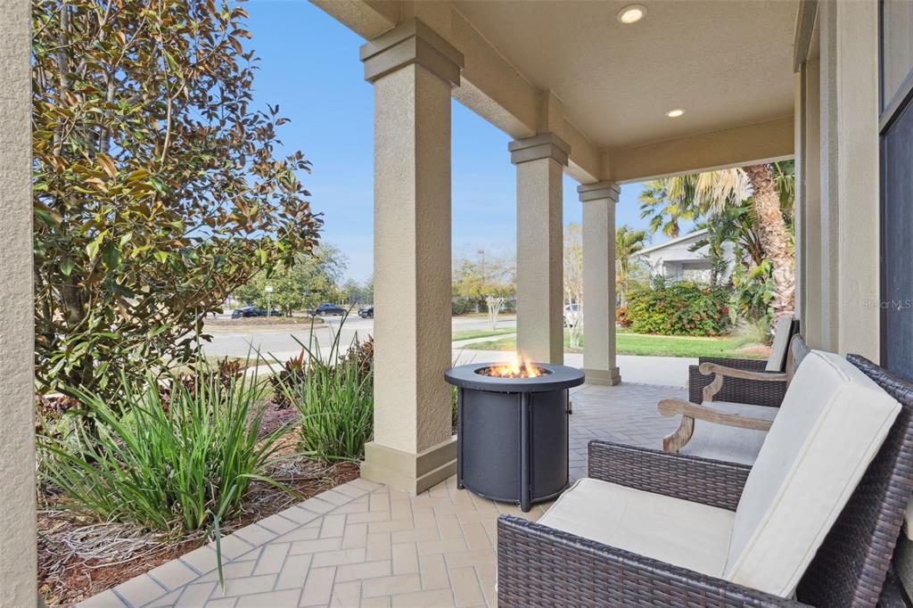 8816 Shady Pavillion Court Land O Lakes, FL 34637 - Photo 4 of 64 a living room with furniture and a floor to ceiling window