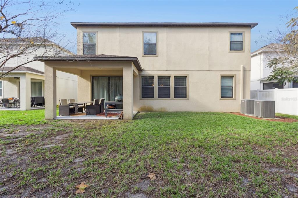 8816 Shady Pavillion Court Land O Lakes, FL 34637 - Photo 45 of 64 a view of a house with backyard and porch