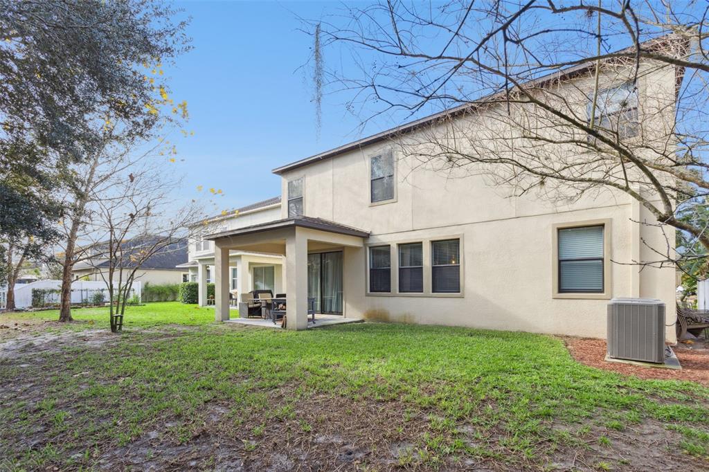 8816 Shady Pavillion Court Land O Lakes, FL 34637 - Photo 46 of 64 a view of a house with yard and a tree