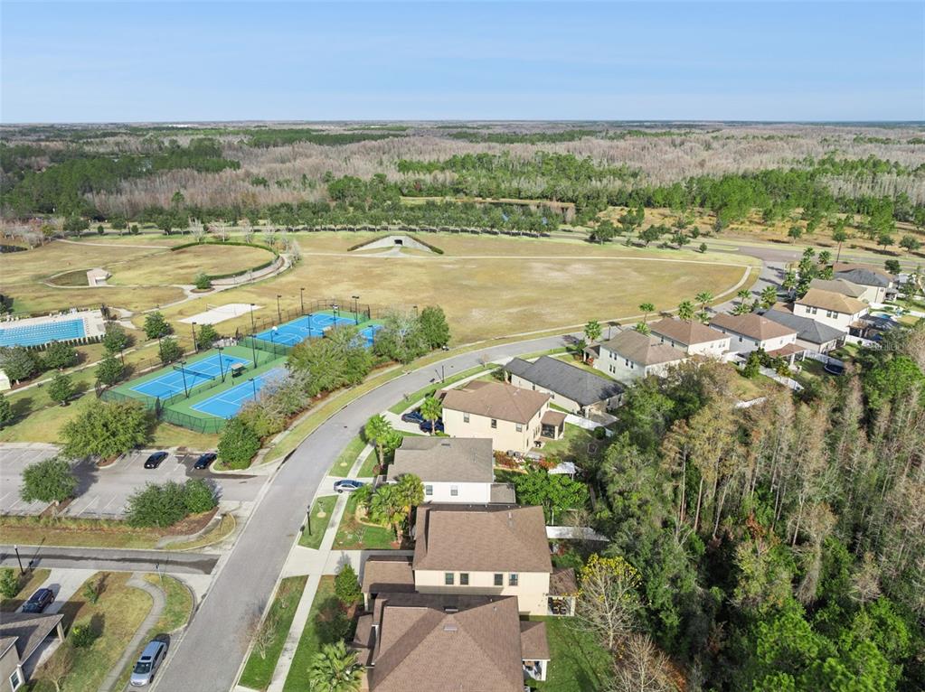 8816 Shady Pavillion Court Land O Lakes, FL 34637 - Photo 54 of 64 an aerial view of ocean and residential houses with outdoor space