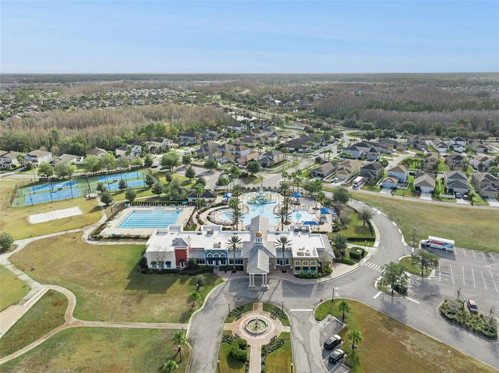 8816 Shady Pavillion Court Land O Lakes, FL 34637 - Photo 62 of 64 an aerial view of a city with lake view