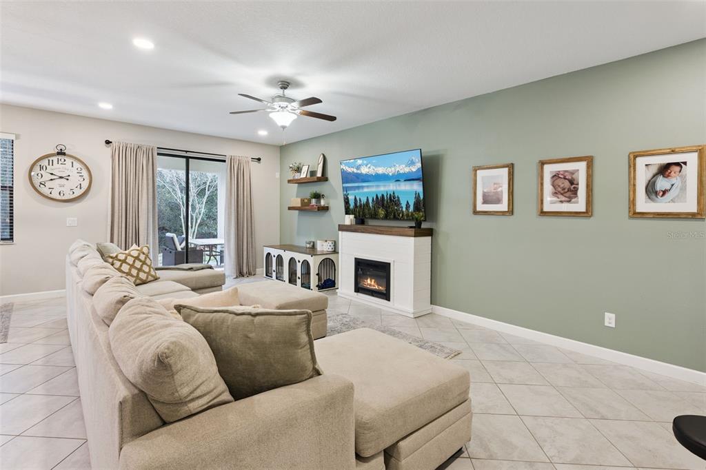 8816 Shady Pavillion Court Land O Lakes, FL 34637 - Photo 7 of 64 a bedroom with a bed and a flat screen tv