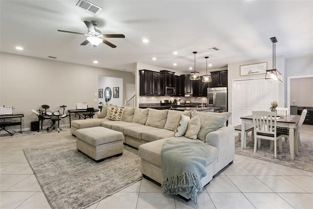 8816 Shady Pavillion Court Land O Lakes, FL 34637 - Photo 10 of 64 a living room with furniture and kitchen view