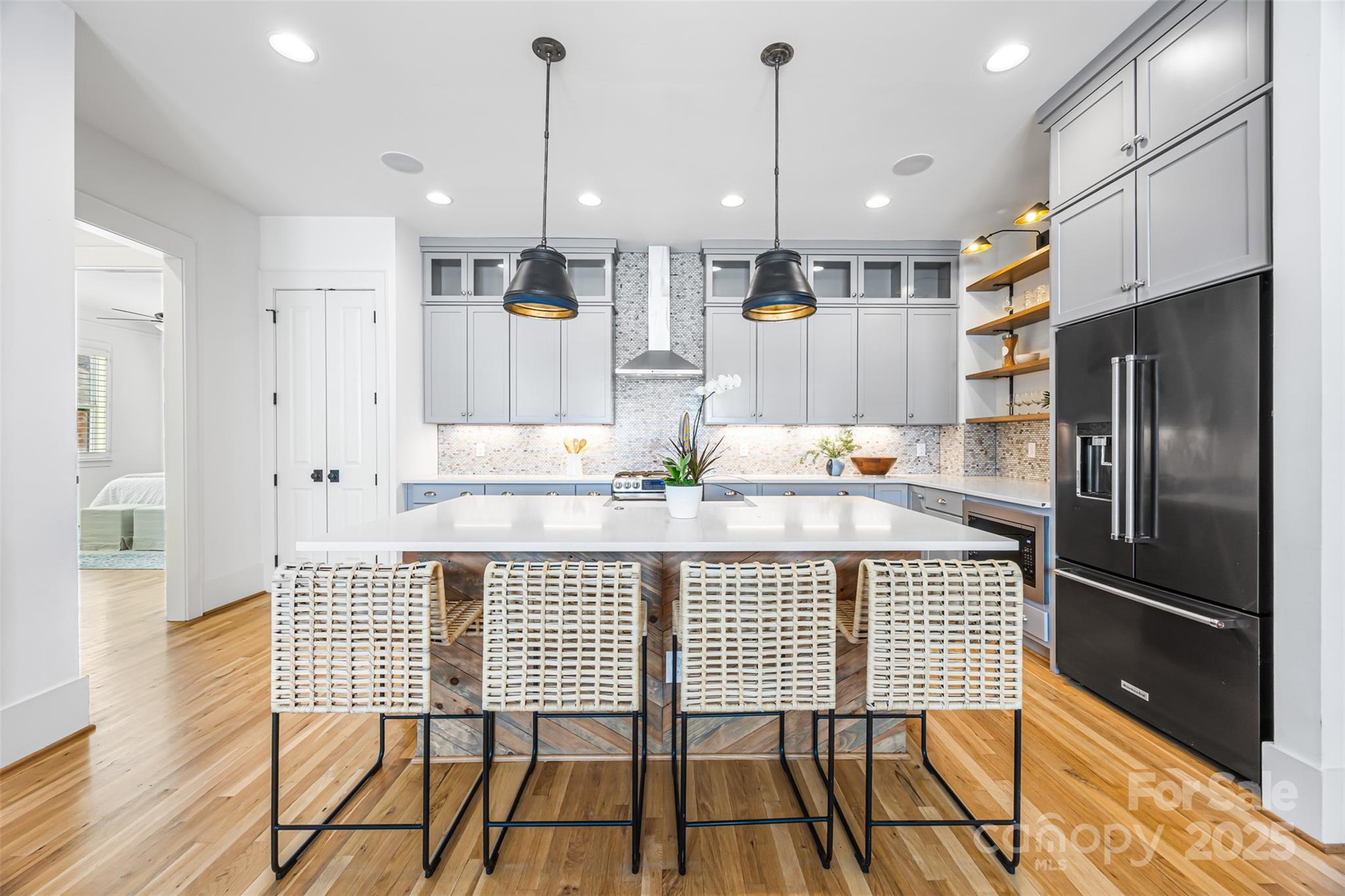 135 Inspired Way Fort Mill, SC 29708 - Photo 14 of 48 a kitchen with stainless steel appliances granite countertop a refrigerator a sink and a stove