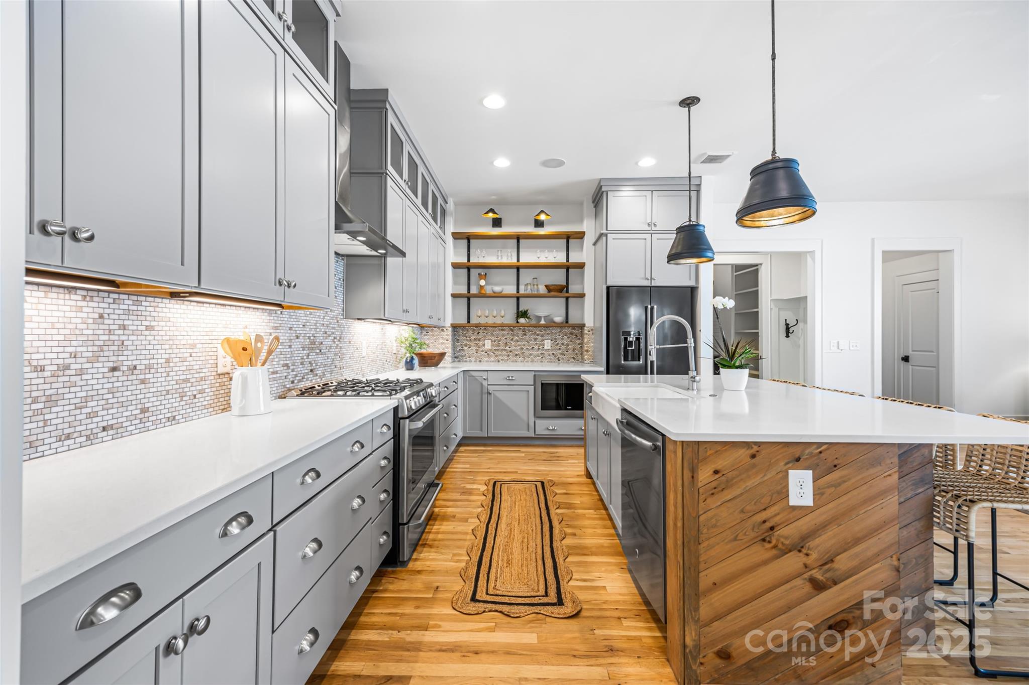 135 Inspired Way Fort Mill, SC 29708 - Photo 15 of 48 a kitchen with sink and view of living room