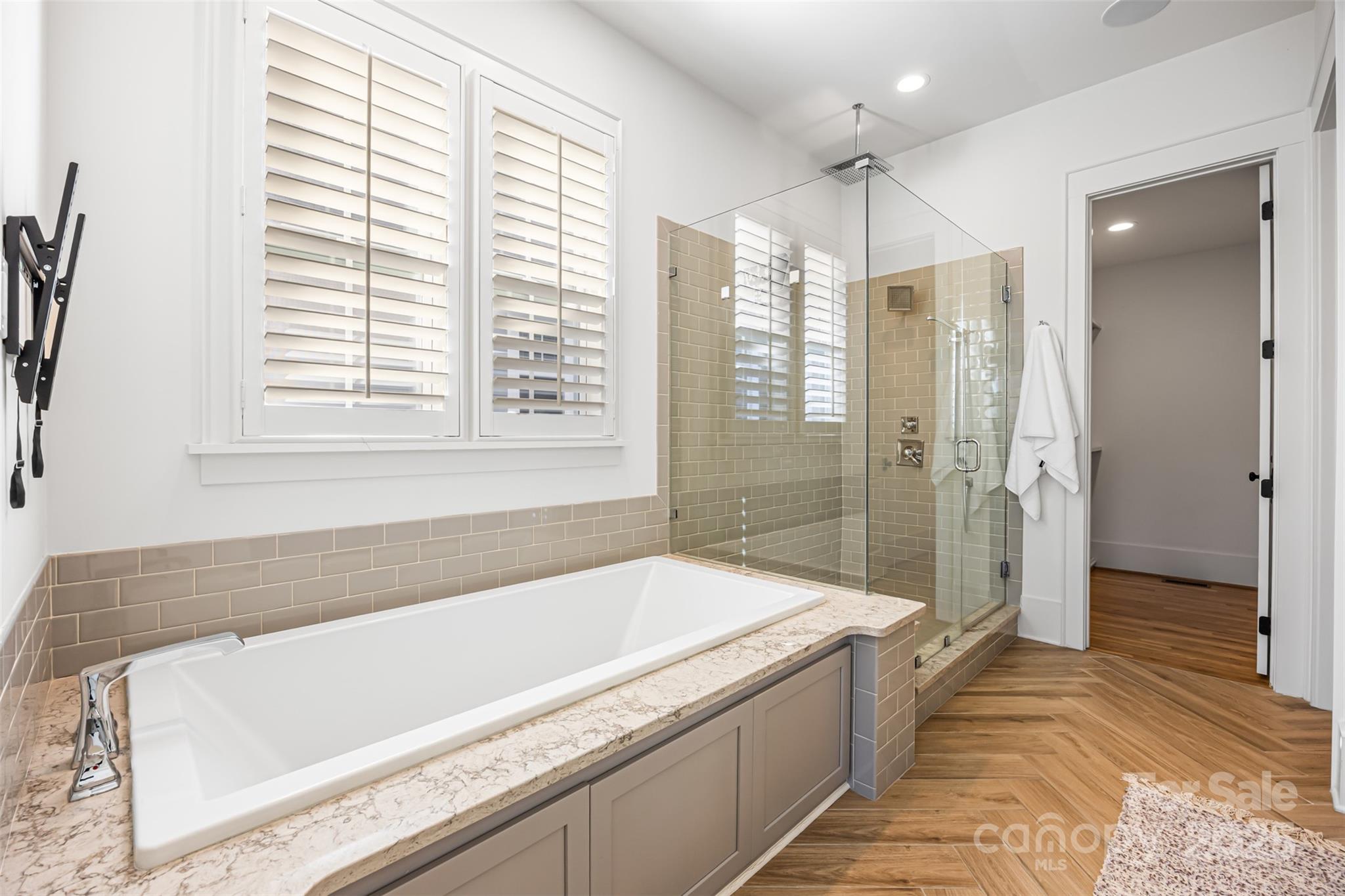 135 Inspired Way Fort Mill, SC 29708 - Photo 21 of 48 a spacious bathroom with a granite countertop tub and a shower