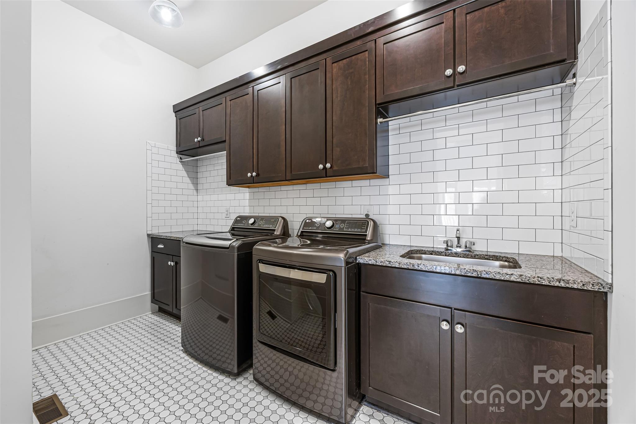 135 Inspired Way Fort Mill, SC 29708 - Photo 24 of 48 a kitchen with stainless steel appliances granite countertop a sink stove and cabinets