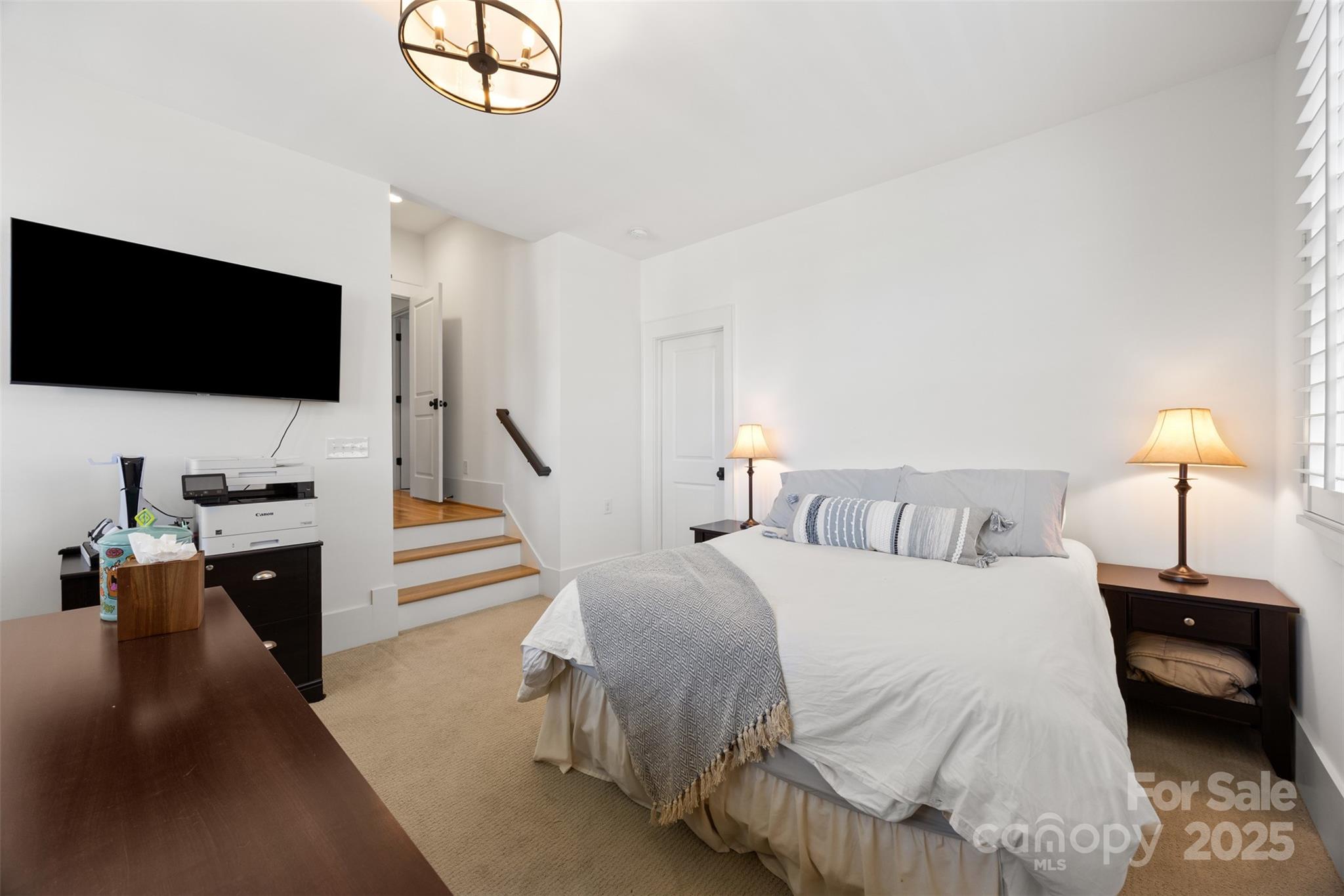 135 Inspired Way Fort Mill, SC 29708 - Photo 30 of 48 a bedroom with a bed and a flat screen tv