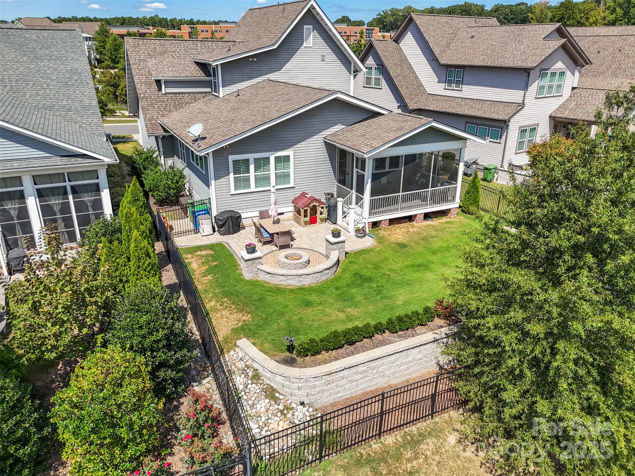 135 Inspired Way Fort Mill, SC 29708 - Photo 40 of 48 a view of a patio with table and chairs and potted plants