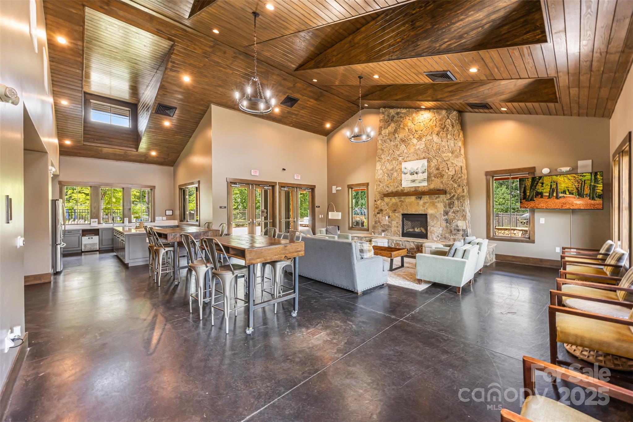 135 Inspired Way Fort Mill, SC 29708 - Photo 45 of 48 a dining room with wooden floor a chandelier a glass table and chairs