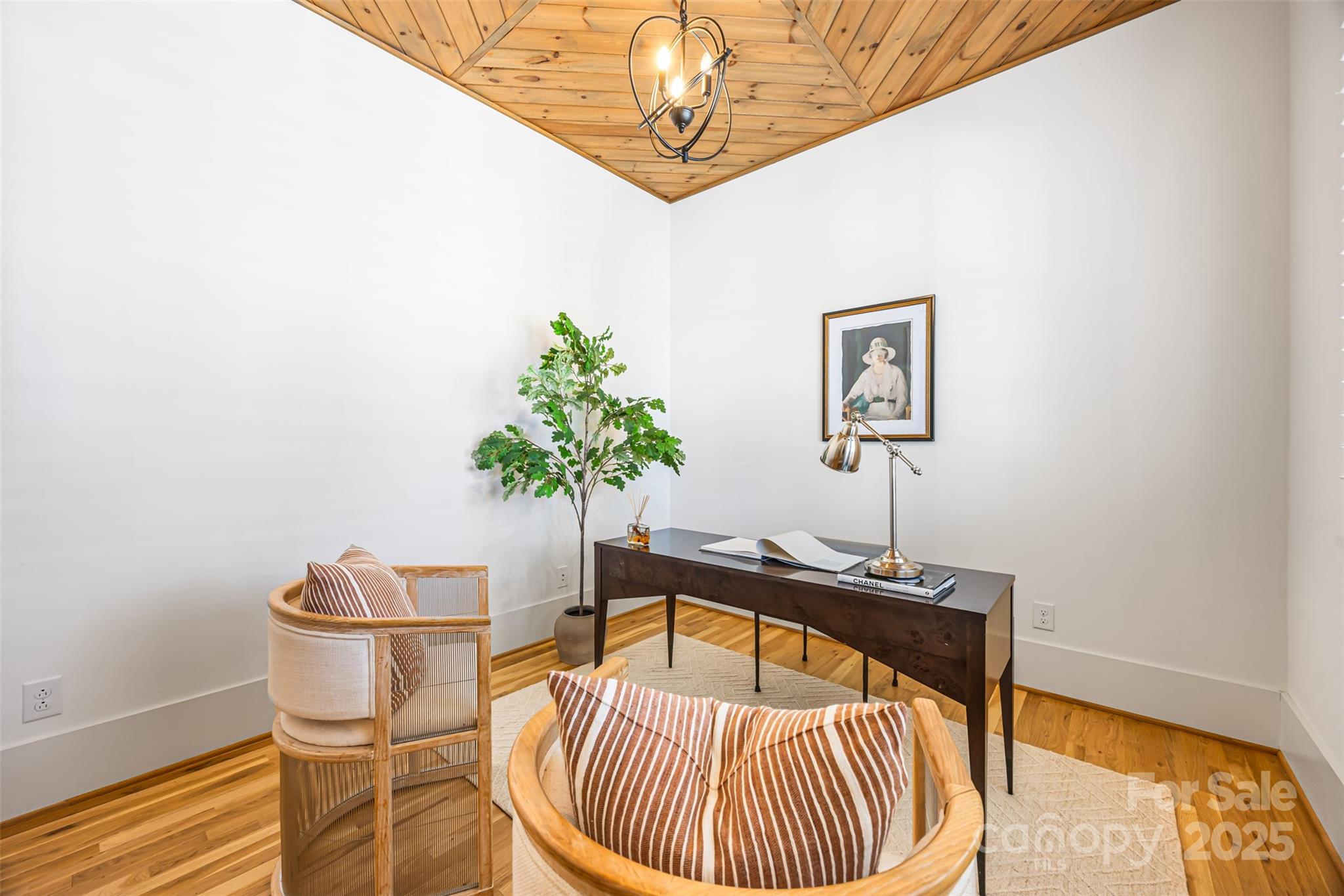 135 Inspired Way Fort Mill, SC 29708 - Photo 7 of 48 a table room with a potted plant and wooden floor