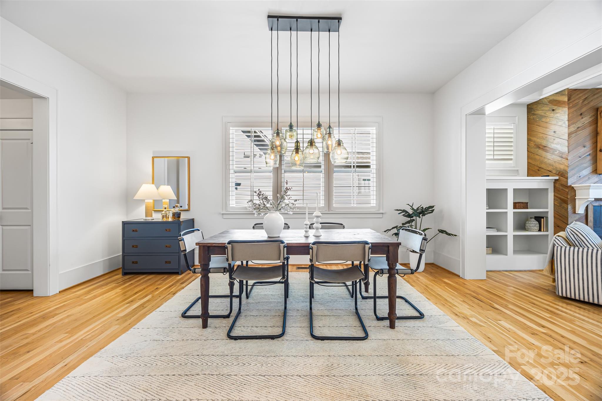 135 Inspired Way Fort Mill, SC 29708 - Photo 9 of 48 a dining room with furniture a chandelier and wooden floor