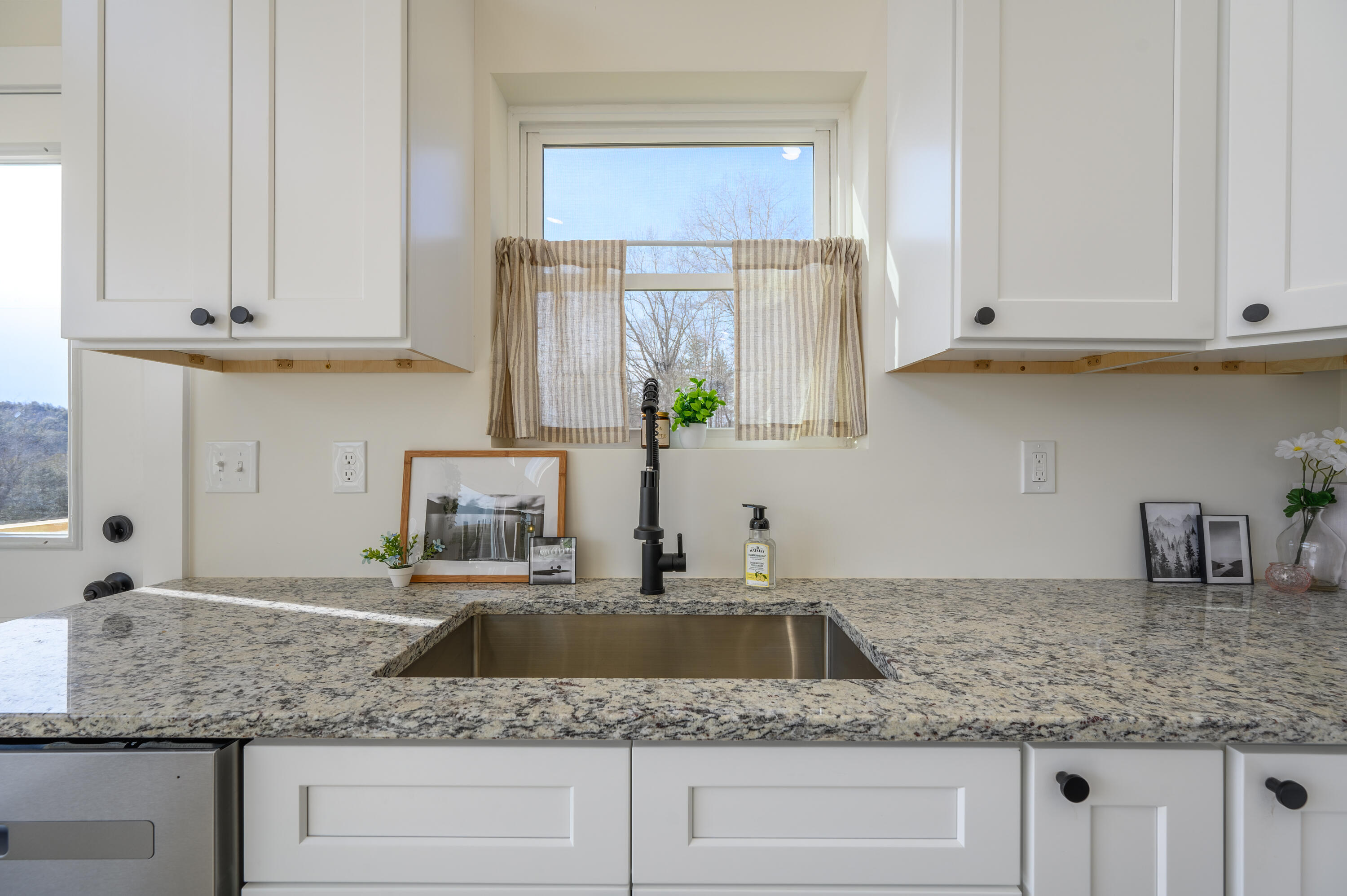 320 Grace Lane Northeast Riner, VA 24149 - Photo 28 of 33 a kitchen with granite countertop white cabinets and a sink