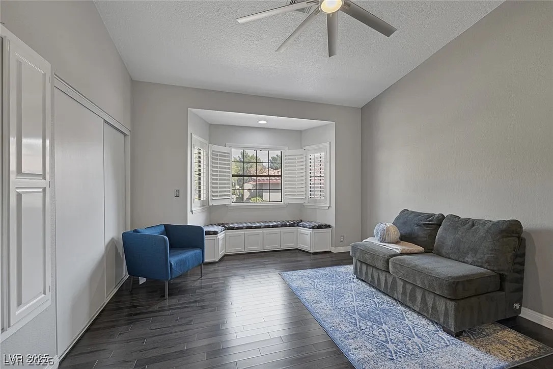 9 Quail Run Road Henderson, NV 89014 - Photo 35 of 57 Naturally illuminated living space features rich wood flooring and a charming built-in window seat with storage.