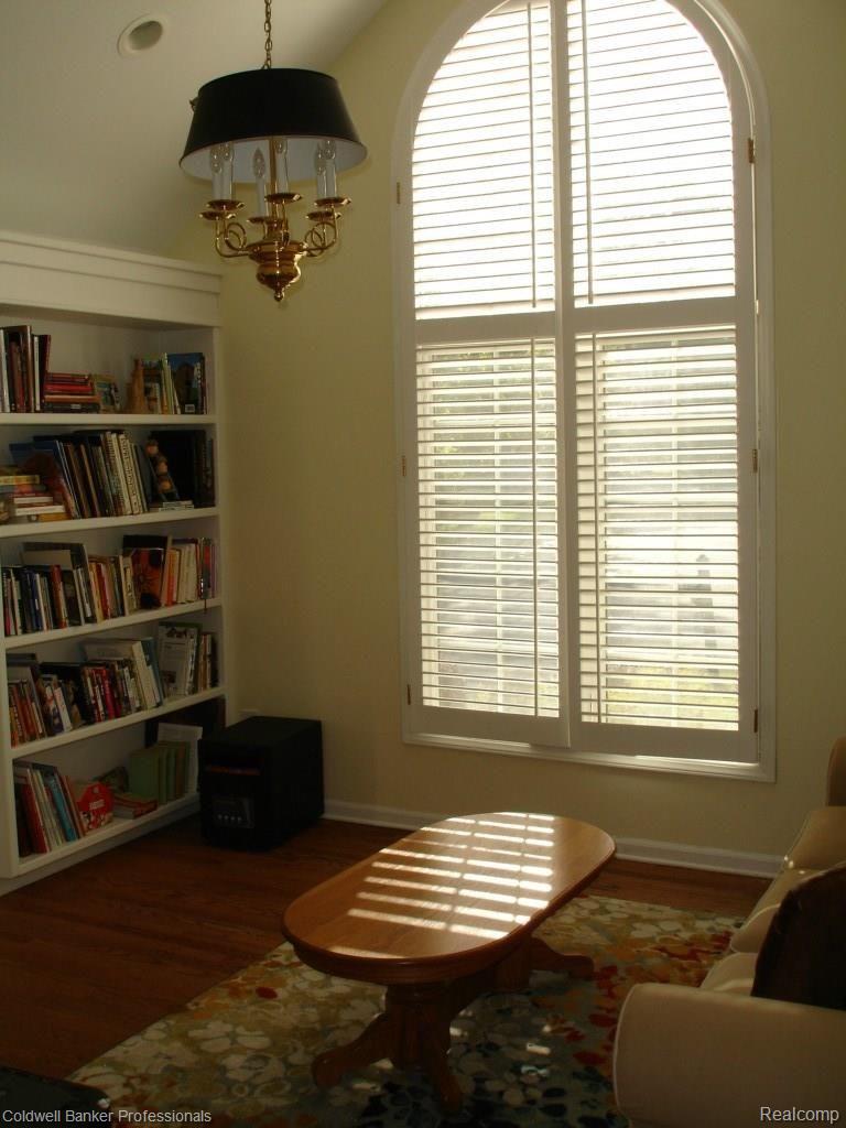 3344 Woodcrest Road Rochester, MI 48309 - Photo 3 of 23 The library has lots of built-ins, a vaulted ceiling, hardwood flooring, and plantation shutters.