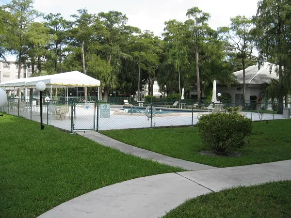 a view of a park with plants and trees