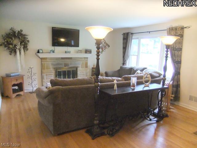 244 Winchester Road Akron, OH 44333 - Photo 4 of 21 Living room features neutral decor, wood flooring, window for natural lighting....