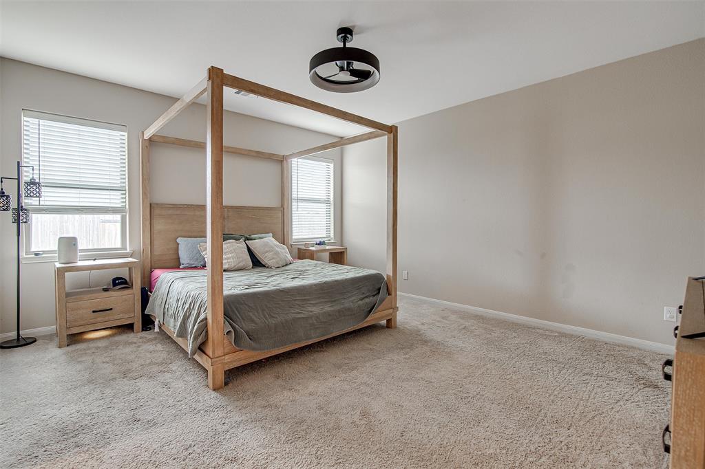 1813 Rialto Lane Crowley, TX 76036 - Photo 15 of 27 a bedroom with a bed and window