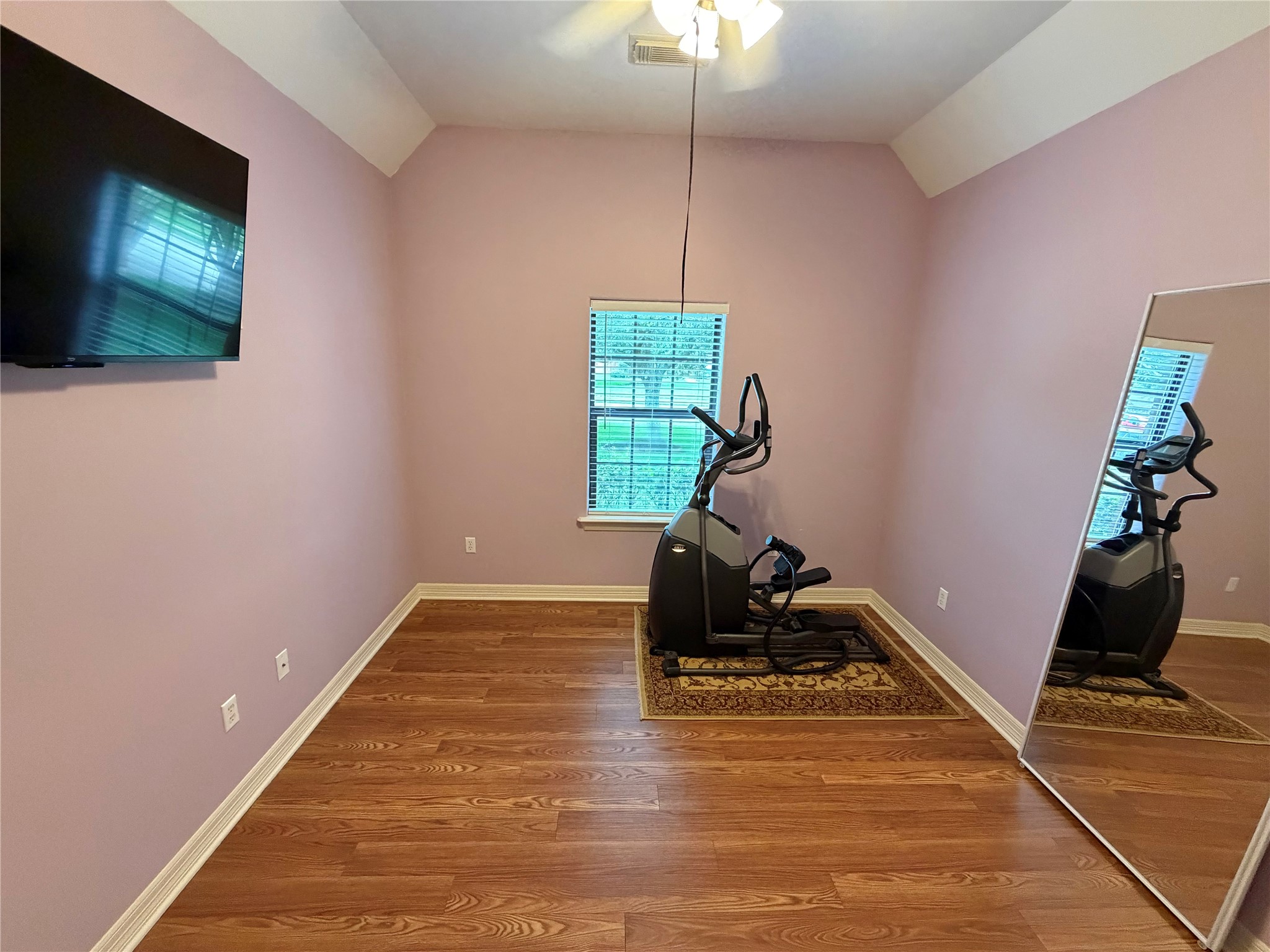 1448 South Blue Bonnet Lane Angleton, TX 77515 - Photo 21 of 43 a room with furniture and a flat screen tv
