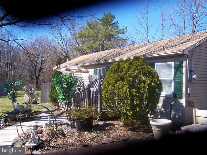 1024 Middle Road Perkasie, PA 18944 - Photo 4 of 14 a view of a backyard with plants and outdoor seating