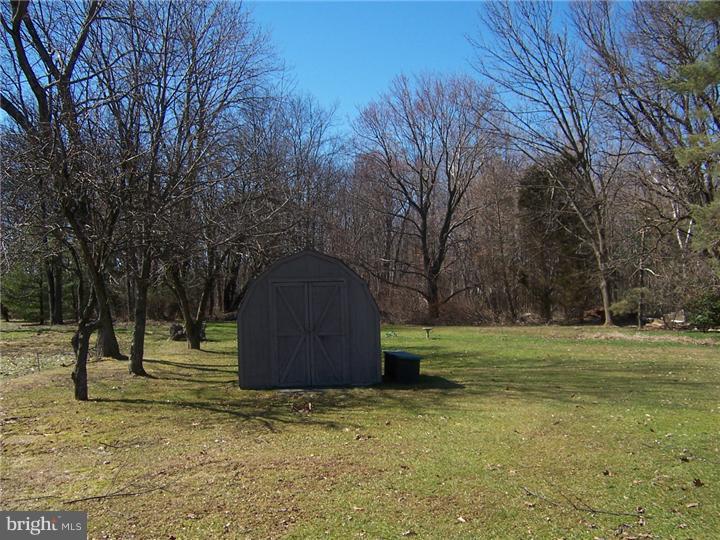 1024 Middle Road Perkasie, PA 18944 - Photo 5 of 14 a big yard with lots of green space and trees