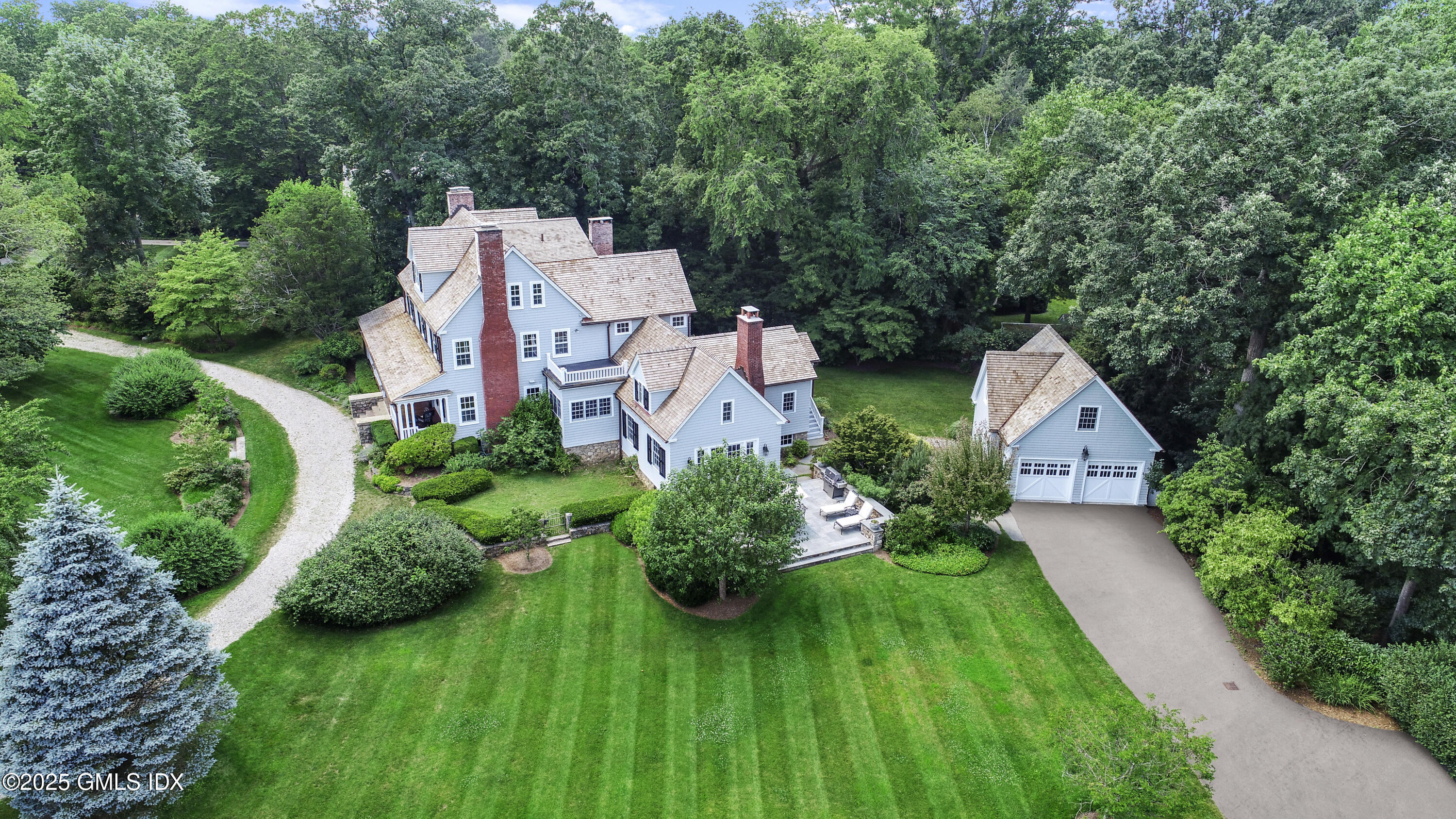 203 Riverside Avenue Riverside, CT 06878 - Photo 2 of 40 an aerial view of a house with pool and garden