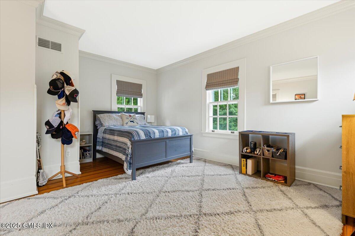 203 Riverside Avenue Riverside, CT 06878 - Photo 24 of 40 a bedroom with furniture and a window