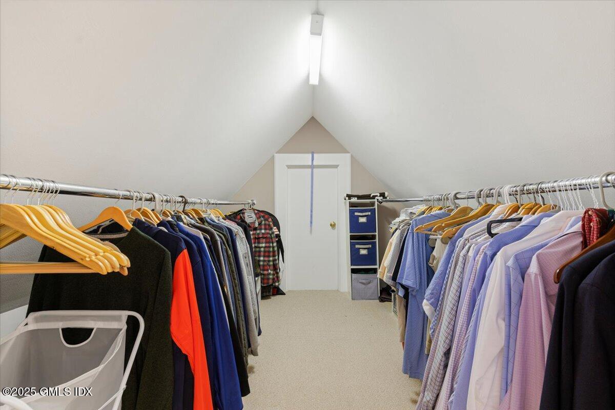 203 Riverside Avenue Riverside, CT 06878 - Photo 25 of 40 a view of walk in closet with clothes and shoes