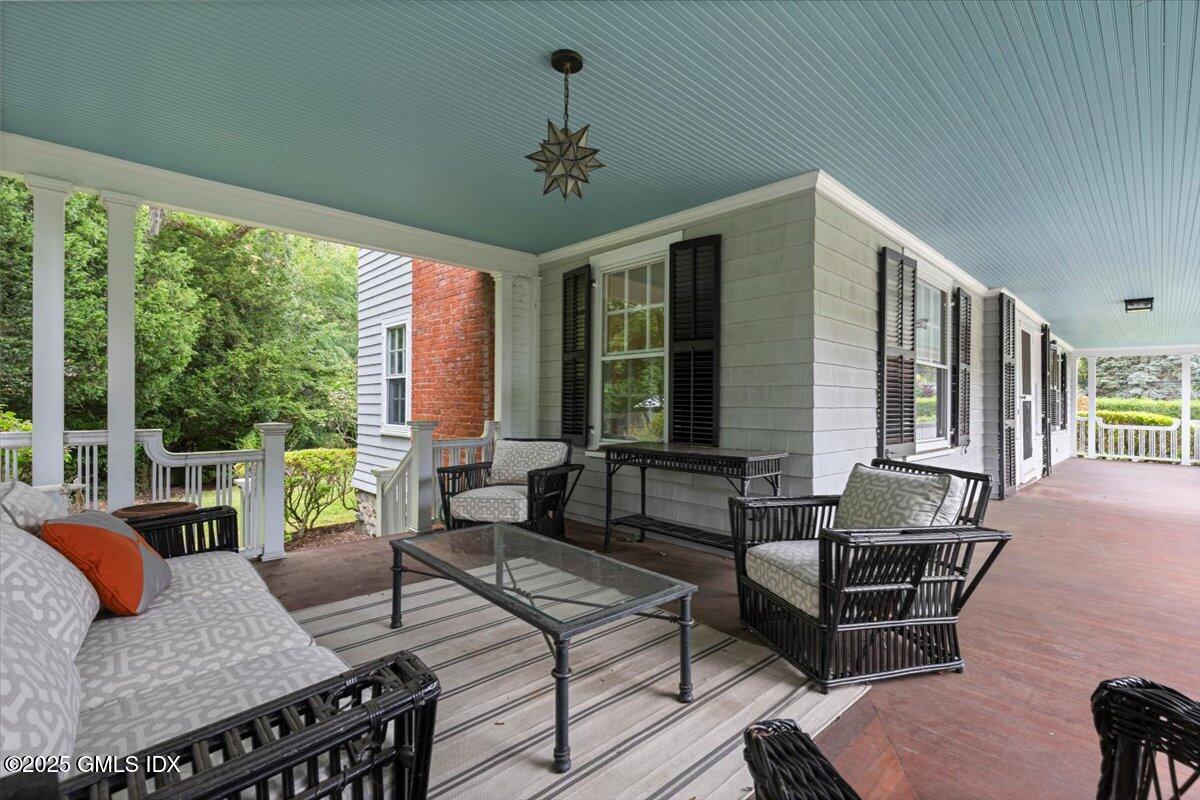 203 Riverside Avenue Riverside, CT 06878 - Photo 3 of 40 a living room with furniture and floor to ceiling windows