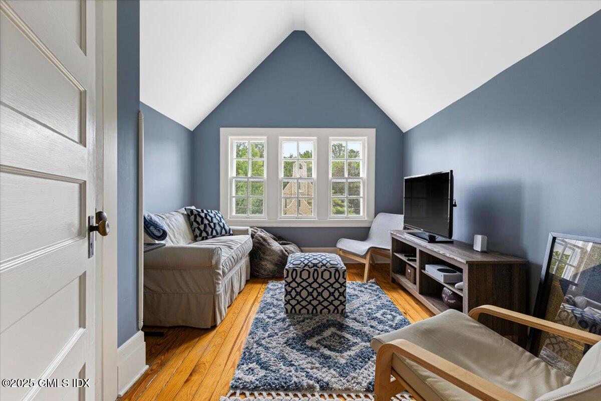 203 Riverside Avenue Riverside, CT 06878 - Photo 31 of 40 a living room with furniture and a flat screen tv